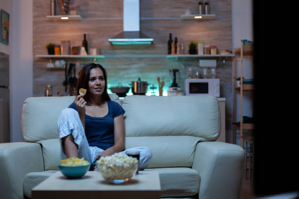 istock Attentive lady watching movie 1926028424