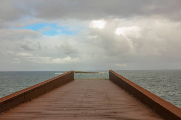 a view of tiny island in the Cantabrian sea from San Cibrao lighthouse