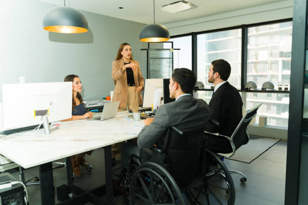 istock Female boss giving some instructions in a diverse and inclusive office 1926073315