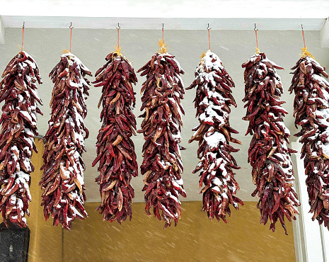 Santa Fe, NM: Row of Chili Ristras Hanging in Snow