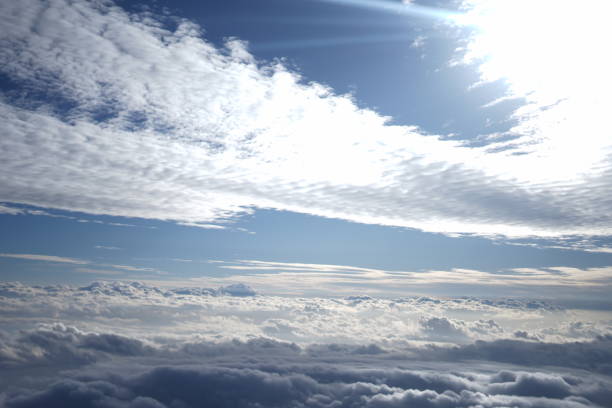 Bright blue sky with large white clouds.