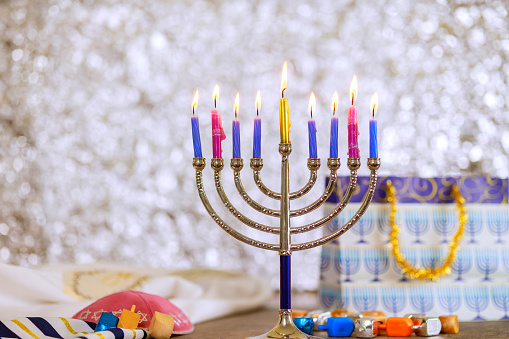 As symbol of Hanukkah in Jewish religion, Hanukkiah Menorah is lit by burning candles