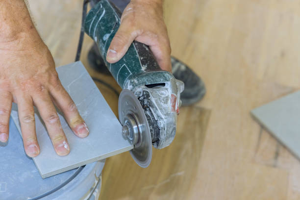 istock Using hand electric grinder with a diamond blade for polishing tile corners 1926180567
