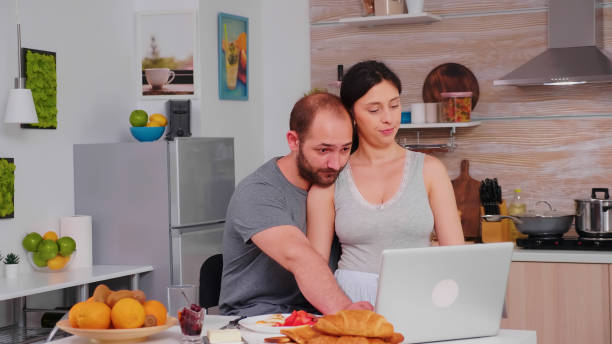 istock Happy couple surfing on internet 1926351694