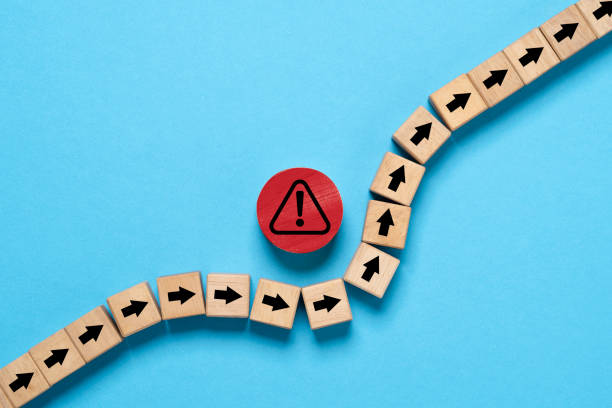 Black arrow avoids red exclamation warning sign symbol for risk analysis management and assessment to prevent disaster  and dangerous concept.