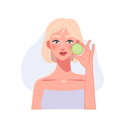 Organic Skincare concept. Facial Treatment with Cucumber Patch. Woman's Portrait with Cucumber Patch
