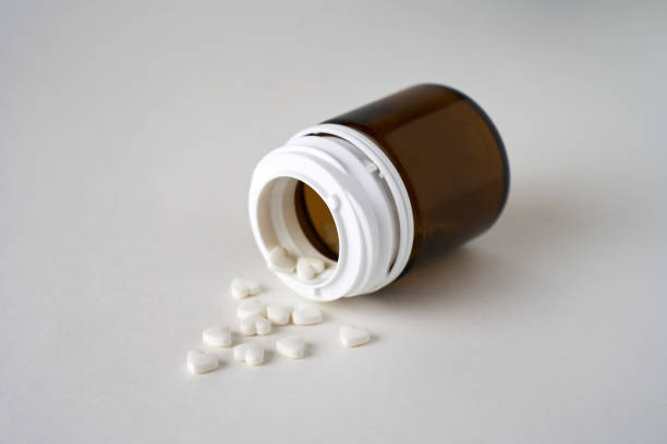 istock Heart shaped pills on a white background with copy space 1926432912