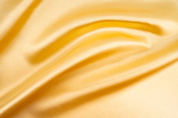 istock Shot of gold satin texture background. 1926433048