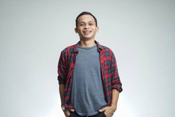 happy expression of handsome asian man. studio shoot isolated on white studio background