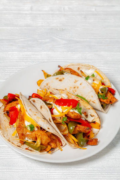 istock baked tex-mex chicken fajitas on a plate, top view 1926476891