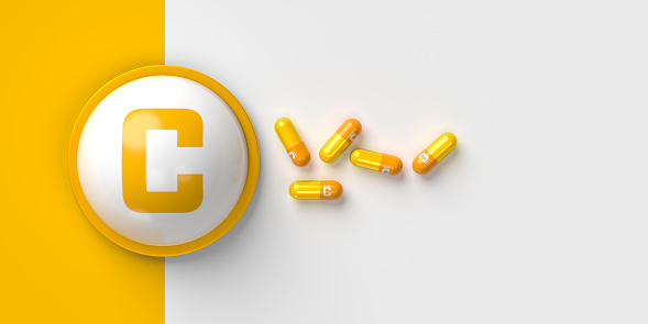 Vitamin C capsules isolated on white background. Creative image of vitamin C capsules. 3D illustration
