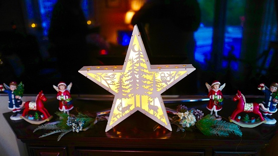 Angel miniature wooden chapel plays Christmas music at Christmas time
