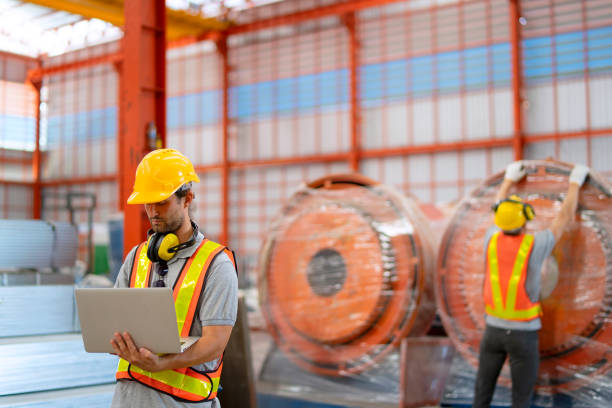 istock Blue collar workers are working at metal warehouse. 1926609973