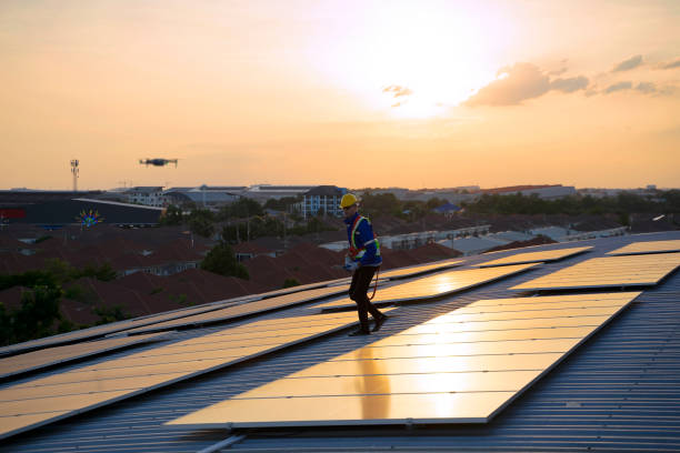 istock Blue collar workers are checking solar panel at roof top. 1926611201