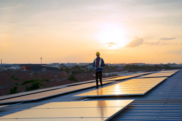 istock Blue collar workers are checking solar panel at roof top. 1926611716