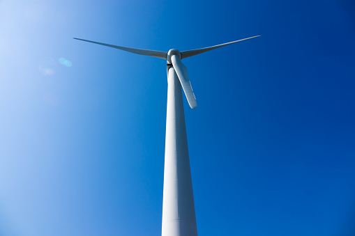 Shooting wind power generation against a blue sky background