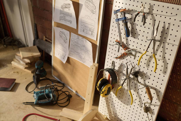 istock Close Up of Carpenters Tools on Pegboard in Workshop 1926647129