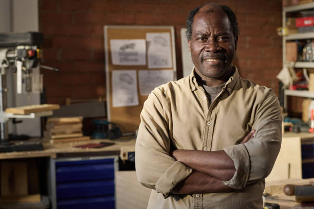 istock Senior Black Man as Carpenter Smiling at Camera 1926647133