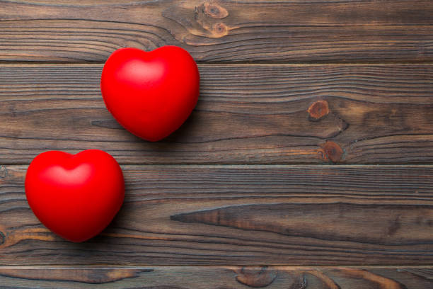 istock red heart shape on colored background. minimal concept top view with copy space 1926660291