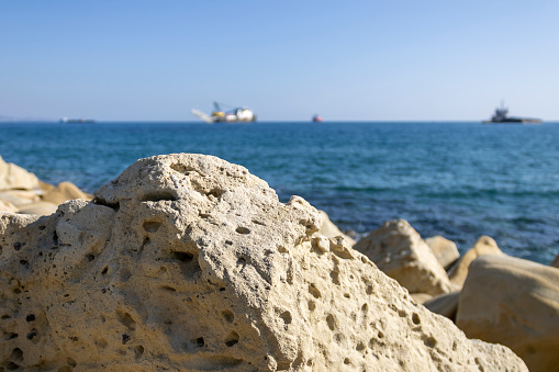 Close-up of white rocks in front of blue sea and sky, Limassol, Cyprus