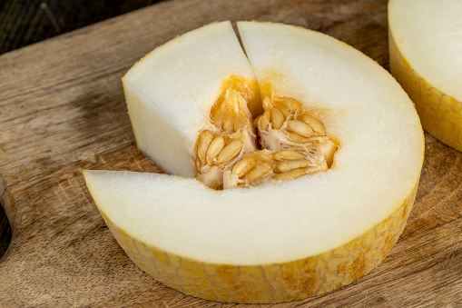 sliced sweet light yellow melon, cooking with golden melon close-up