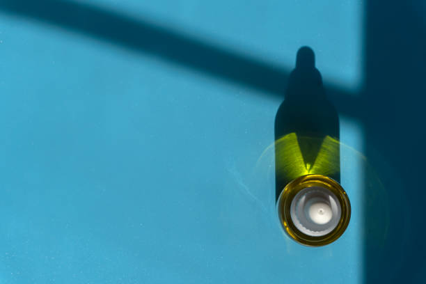 istock Cosmetic oil with pipette on blue background 1926737315
