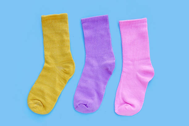istock Colorful socks on blue background. 1926831113