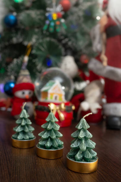 istock three candles in shape of fir trees, soft focus close up 1926833484