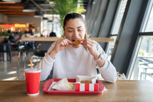 istock Eating Unhealthy Fast Food 1926840530