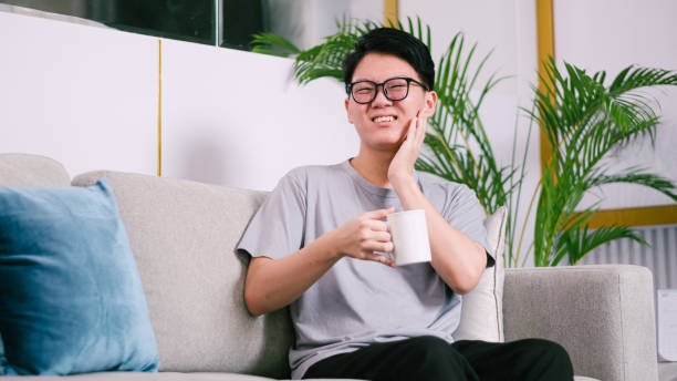 istock Asian Man Feel Hurt From Sensitive Tooth And Holding His Cheek. 1926851861