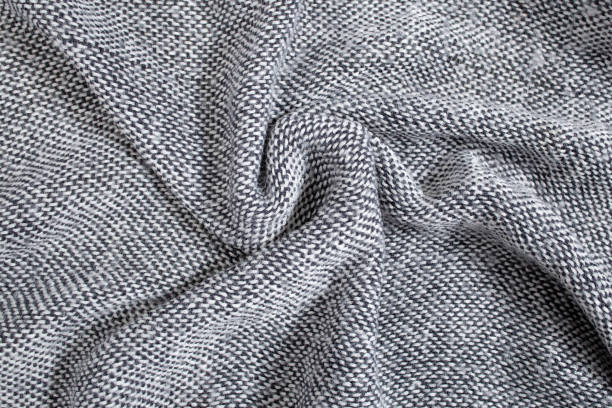 istock Soft and creased gray fabric, warm abstract  backdrop texture 1926858046