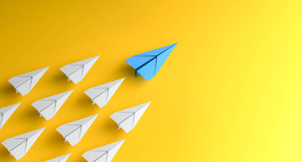 istock Leadership concept, blue leader plane leading white planes, on yellow background 1926873650