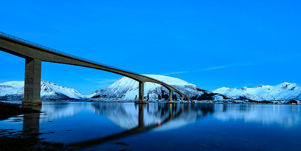Gimsøystraumen Bridge in the Sydalspollen Fjord during sunset in the Lofoten in winter