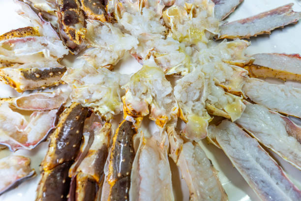 istock Uncooked king crabs cut and placed on plates 1926880533