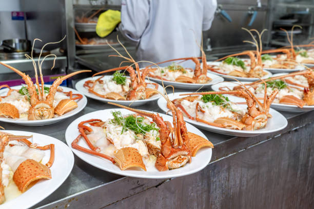 istock Red lobsters placed on white plates after cooking 1926886404