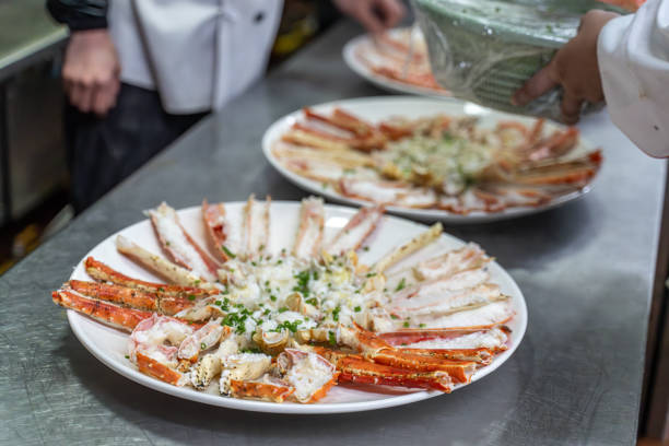 istock The chef's hand is adding seasoning to the cooked king crab 1926891742