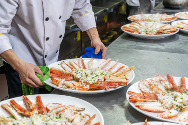 istock The chef is adding seasoning to the cooked king crab on the plate 1926895927