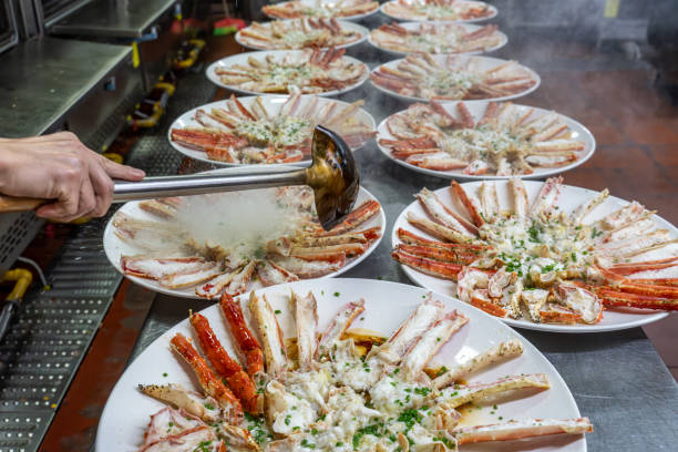 istock The chef is adding seasoning to the cooked king crab on the plate 1926899066