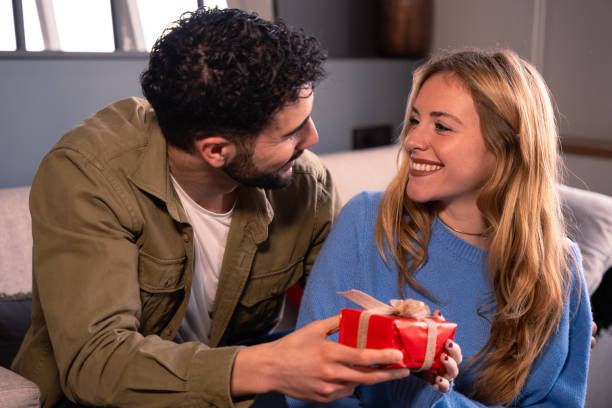 istock Valentine's Day celebration, gift giving and romantic couple concept. 1926927356