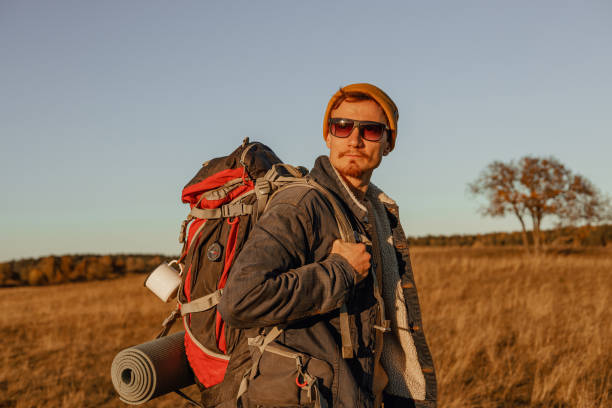 istock Traveler with backpack in autumn nature 1926930053