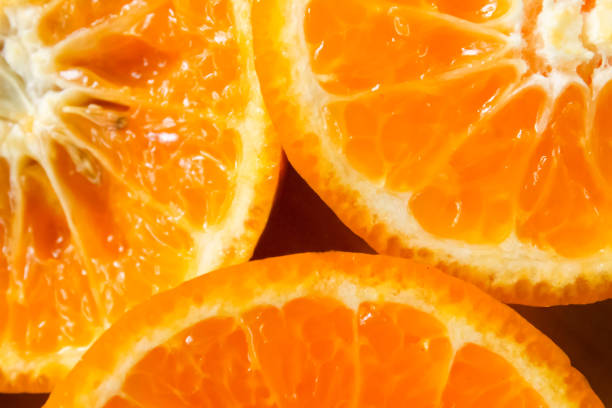 zbliżenie na plasterki owoców pomarańczy - cynga zdjęcia i obrazy z banku zdjęć