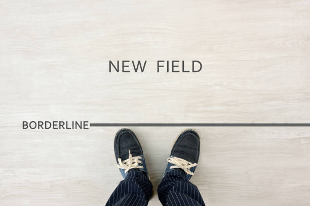 istock Man standing by borderline for new field 1926942837
