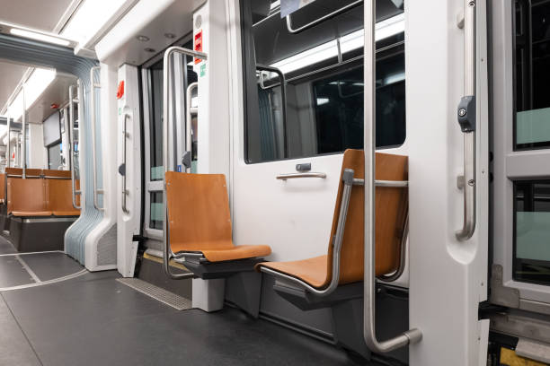 istock Empty public transportation tram car. Inside shot, nighttime, no people, empty seats 1926951733