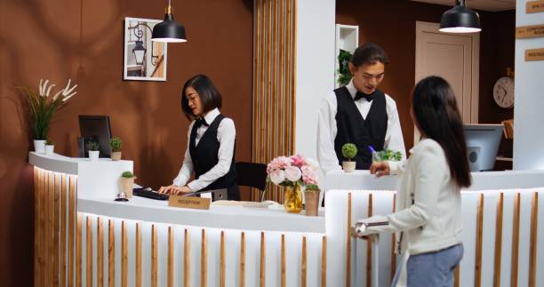 istock Tourist entering hotel reception to go through registration 1926969214
