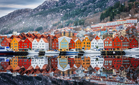 Beautiful view of the colourful Bryggen district at Bergen, Norway, on a winter day with snow