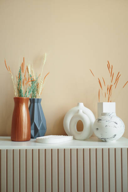istock home interior decoration against light orange color wall . 1927020083