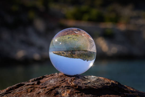 istock Glass ball lying on a rusty bollard 1927033374