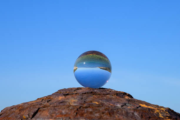 istock Glass ball lying on a rusty bollard 1927033375