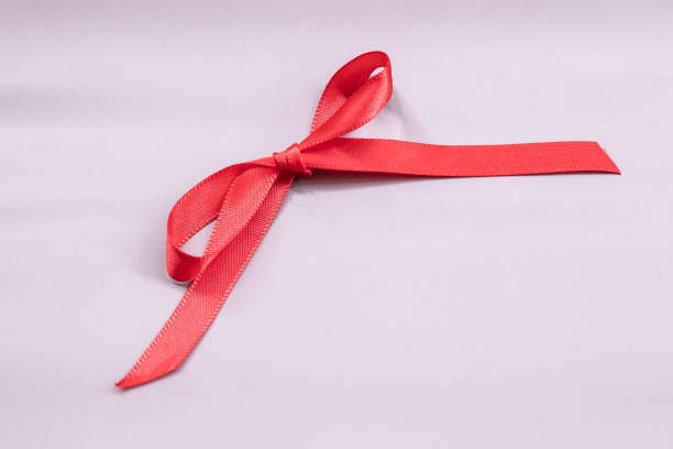 istock red silk ribbon isolated on background, design element for gift decoration, line 1927058723