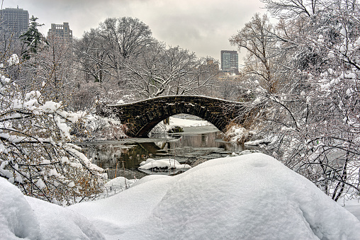 Gapstow Bridge in Central Park during snow storm, early orning